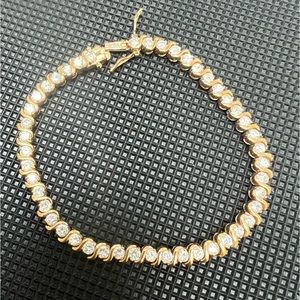 Gold toned tennis bracelet